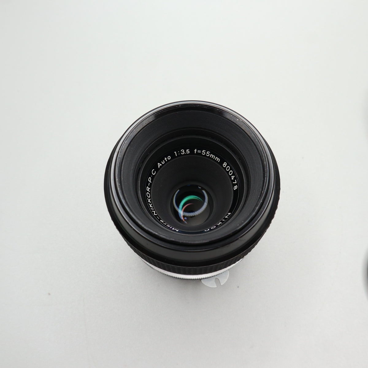 Nikon Micro-Nikkor-P C Auto 55mm f/3.5 Pre-AI con paraluce HS-2