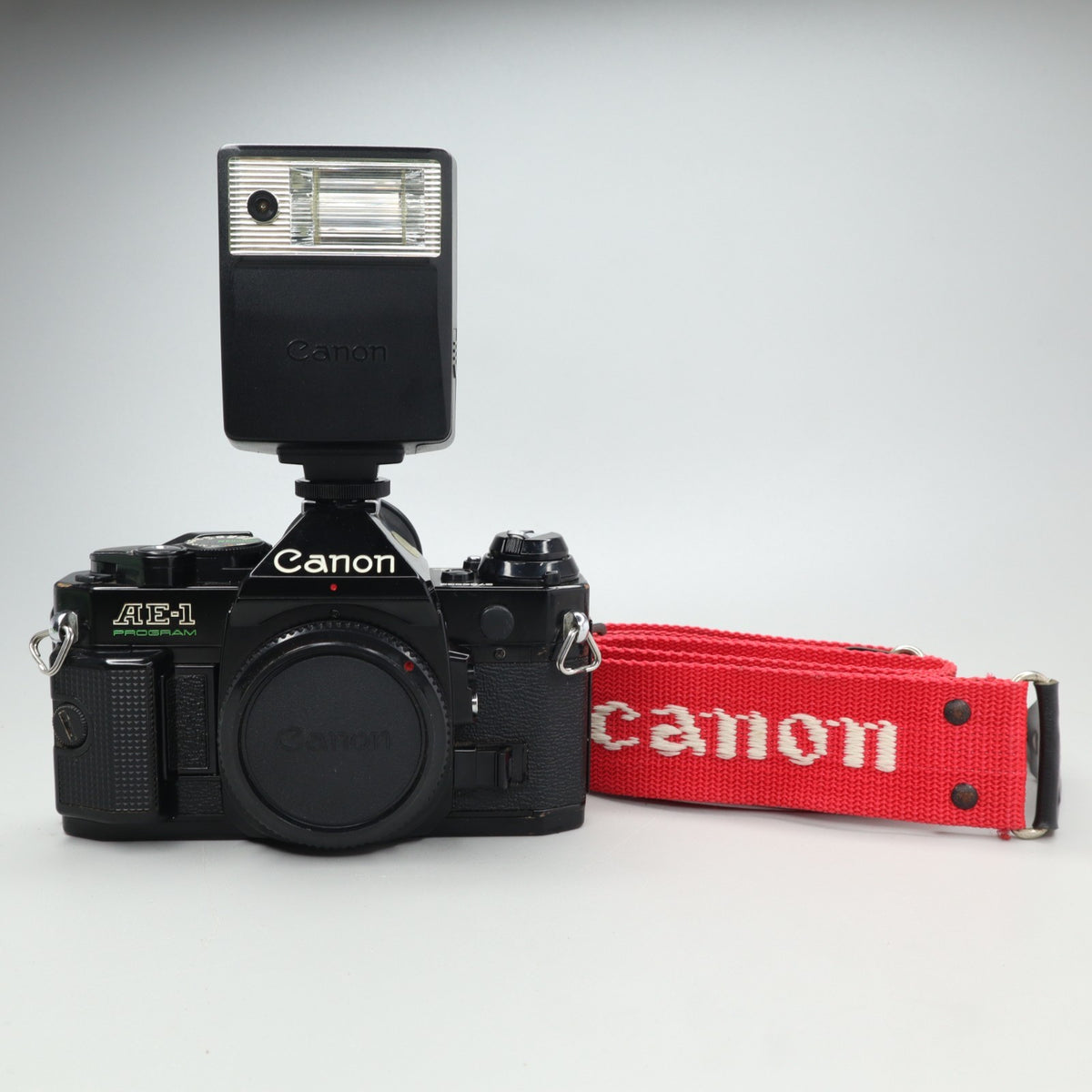 Canon AE-1 Program Nera con Tracolla e Flash Speedlite 133A